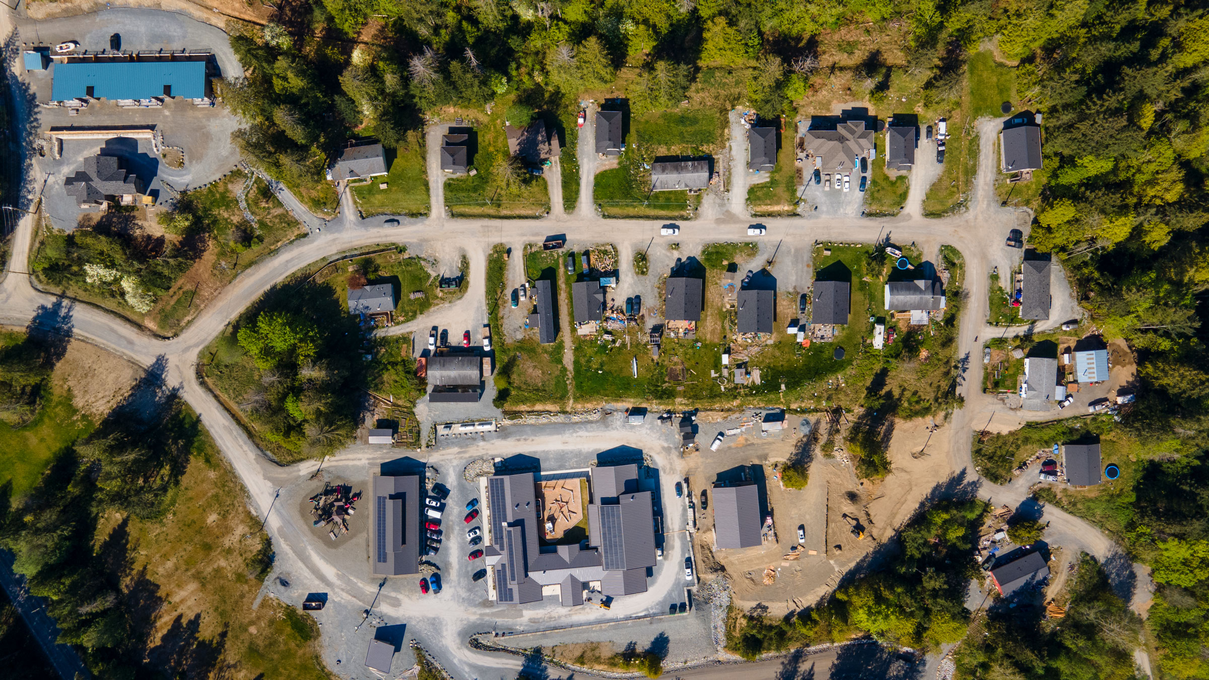 A drone overview of the upper community. Residences along the top and right edge, office buildings on the bottom.